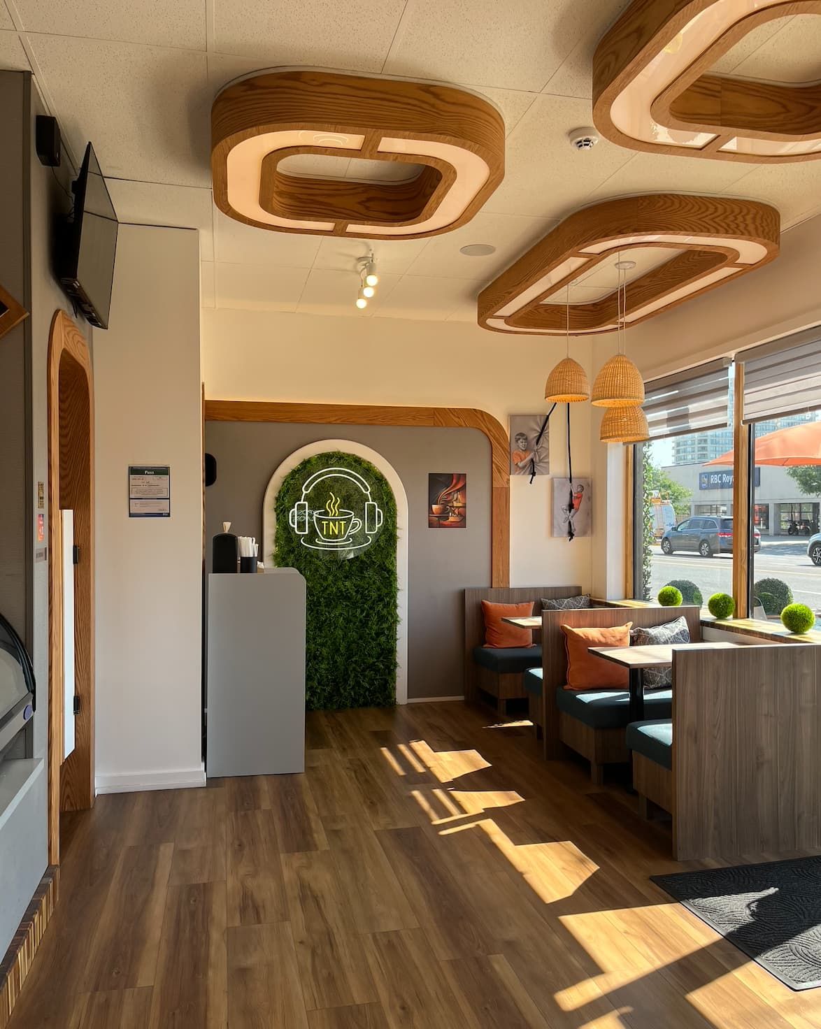 Bright dining area inside TNT Cup Coffee in Mississauga