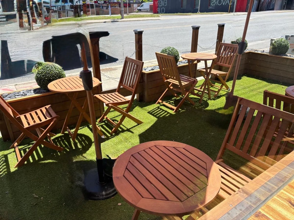 Outdoor patio seating at TNT Cup Coffee